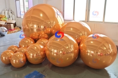 wedding corporate event balloons backdrop decor oversized big shiny giant golden orange inflatable mirror balls/spheres