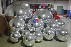 Silver color big shimmery inflatable spheres Silver giant mirror ball for event decoration Floral designs companies