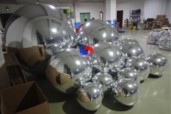 Silver color big shimmery inflatable spheres Silver giant mirror ball for event decoration Floral designs companies