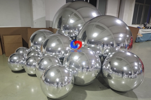 Silver color big shimmery inflatable spheres Silver giant mirror ball for event decoration Floral designs companies