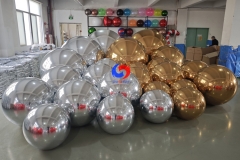 christmas holiday corporate event decor styling luxury giant Shimmering Gold big shiny balls Silver Balloon Orbs