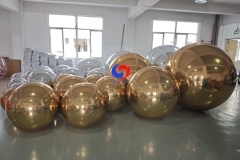 christmas holiday corporate event decor styling luxury giant Shimmering Gold big shiny balls Silver Balloon Orbs