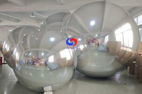 Corporate celebration backdrop giant balloons big shiny silver inflatable sphere mirror balls as decoration