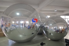 Corporate celebration backdrop giant balloons big shiny silver inflatable sphere mirror balls as decoration