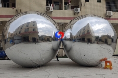 Corporate events backdrop giant balloons hanging big shiny silver inflatable sphere mirror balls as decoration